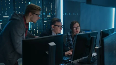 Three IT Engineers / Programmers Talking about Work, Using Computers. Technican Stock Footage 103273290