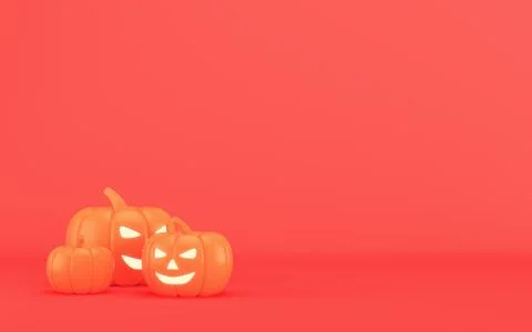 Three jack-o'-lantern pumpkins on a red background with copy space for seas.. Stock Illustration
