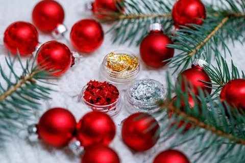 Three jars with multi-colored patal for nail design. Christmas photo. Foto stock