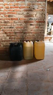 Three jerry cans of water Stock Photos