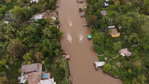 Three Jet ski cruising on Delta of Tigre in Buenos Aires. Dirty Parana River in Stock-Footage 299999088