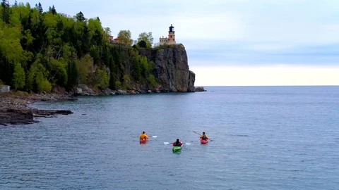 Three Kayakers at Split Rock Lighthouse, Minnesota, Aerial Drone Stock Footage 115043450