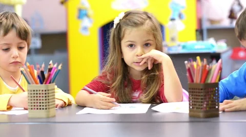 Three kids drawing at kindergarten Stock Footage 61273936