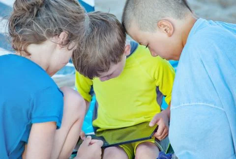 Three Kids Tablet Stock Photos