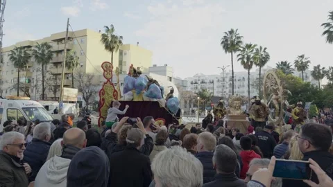 Three Kings Parade Float Surrounded by Crowds in Spain Stock Footage 327510083