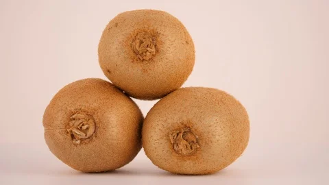 Three kiwi on a rotating table 動画素材 103456602