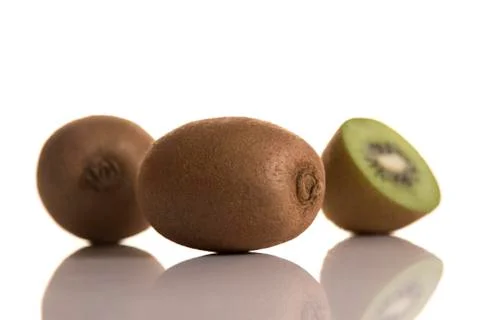 Three kiwis on white background Stock Photos