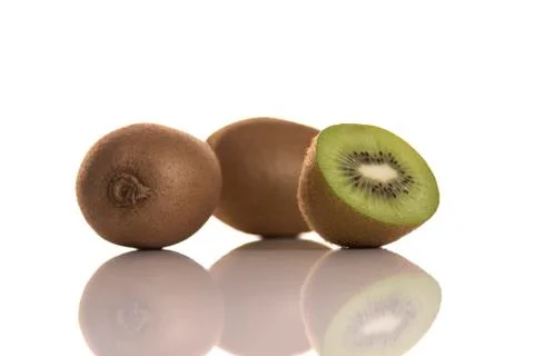 Three kiwis on white background  Stock Photos