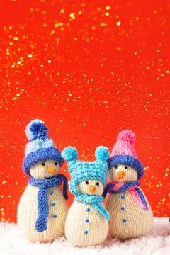 Three knitted snowmen Stock Photos