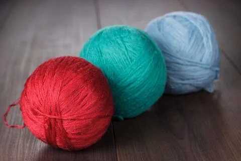 Three knitting balls of threads Stock Photos