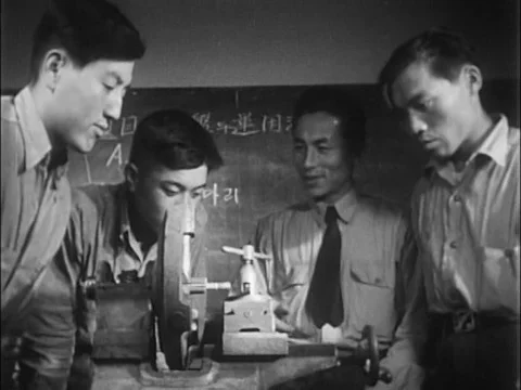 Three Korean men finish their basic naval training and go on to receiveƒ Stock Footage 75307754