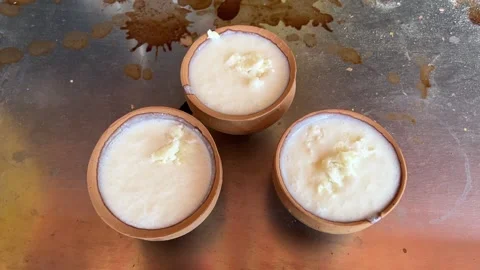 Three kulhad of Milk lassi prepared in a Kolkata hotel in India Stock Footage 310867505