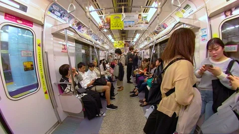 Three ladies talking inside the train in Osaka Japan Stock Footage 129279167