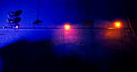 Three lanterns hanging on long chains in nightclub against a brick wall. Video stock 171851170