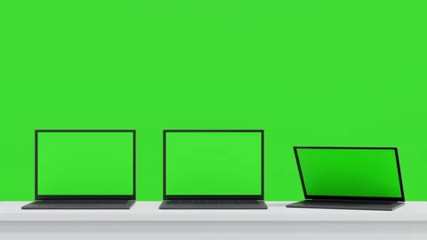 Three laptop open to show green screen display on green background, application Stock Footage 269903583