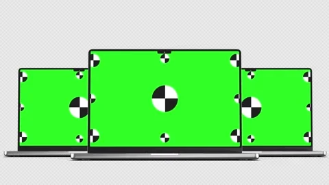 Three laptop revolves around on black background with Alpha channel for chroma Stock Footage 235898374