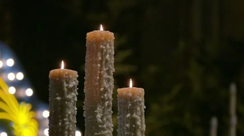 Three large candles at the church altar Stock Footage 63452555