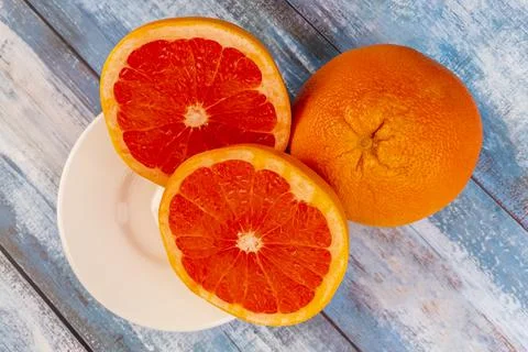Three large grapefruits on a table Stock Photos