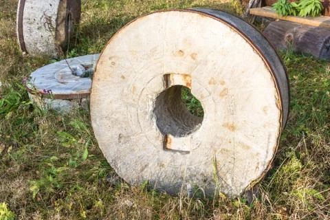 Three large millstones. Stock Photos