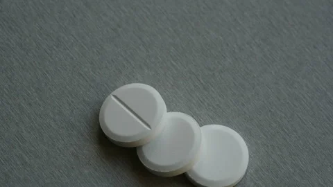 Three large pills for corona virus or vitamins Stock Footage 148040459