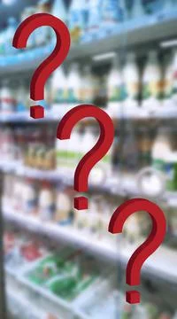 Three large red question mark on blur supermarket background. Defocused store Foto stock