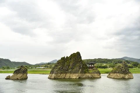 Three large rocks are floating in the water 스톡 사진