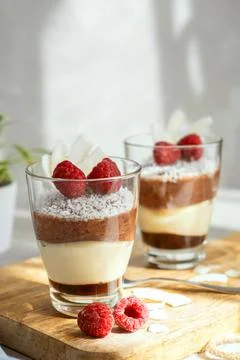Three-layer mousse dessert made of chocolate and vanilla, decorated with fresh Stock Photos