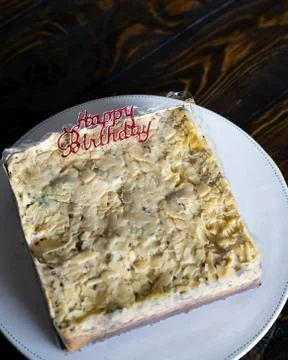Three layer white  chocolate mousse cake with Happy Birthday topper on a cake Stock Photos