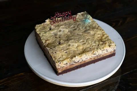 Three layer white  chocolate mousse cake with Happy Birthday topper on a cake Stock Photos