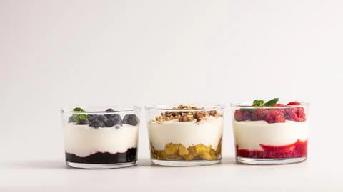 Three layer yogurt desserts. Concept: health, sport nutrition, diet. Stock Photos