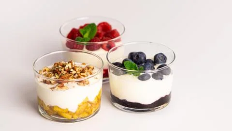Three layer yogurt desserts. Concept: health, sport nutrition, diet. Stock Photos