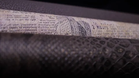 Three leather texture paper rolls pan shot Stock-Footage 86598305