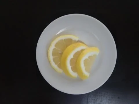 Three lemon slice on the saucer Stock Photos