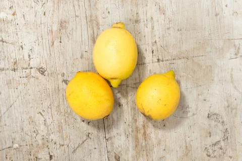 Three Lemons on a Wooden Surface 스톡 사진