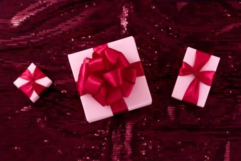 Three light pastel pink boxes tied . Stock Photos