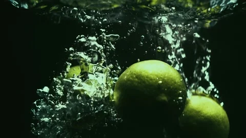 Three Limes Drop in Slow Motion Stock Footage 300892887