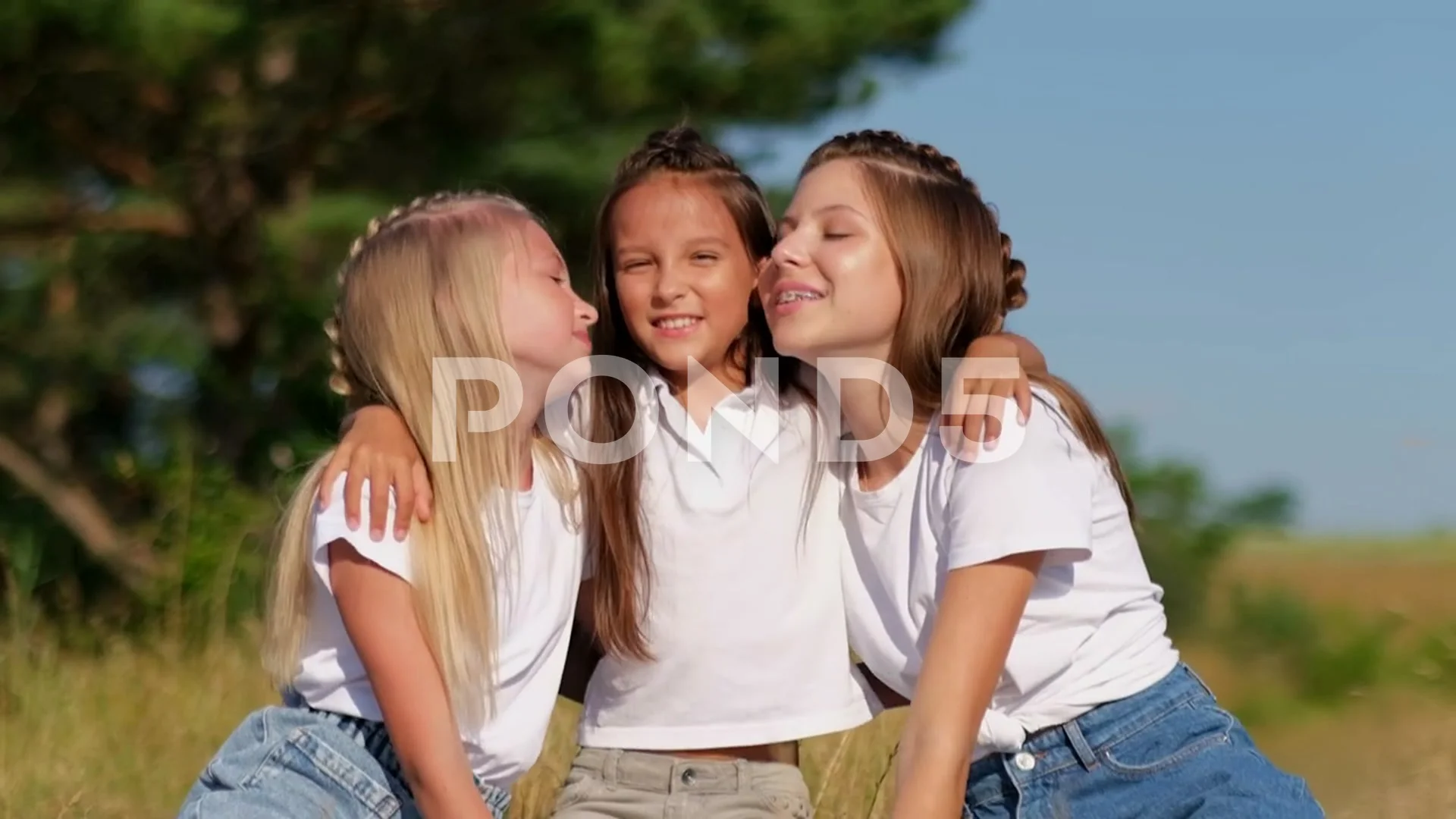 three girls hugging