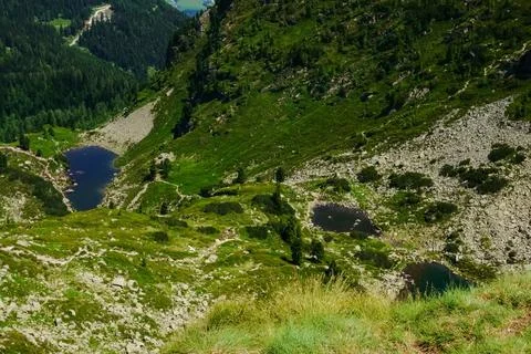Three little mountain lakes while hiking in the mountains Stock Photos