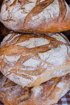 Three loaves of rustic sourdough bread, close up Stock Photos