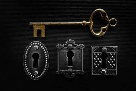 Three locks and gold key Stock Photos