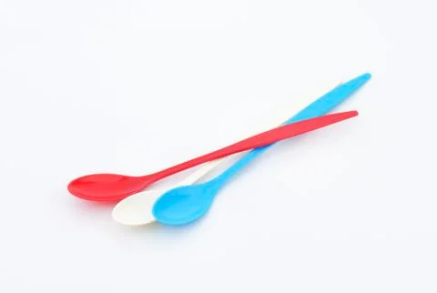 Three long plastic spoons Stock Photos