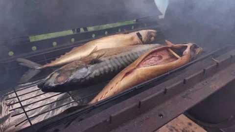 Three mackerel fish are cooked in the grill Stock Footage 239338573