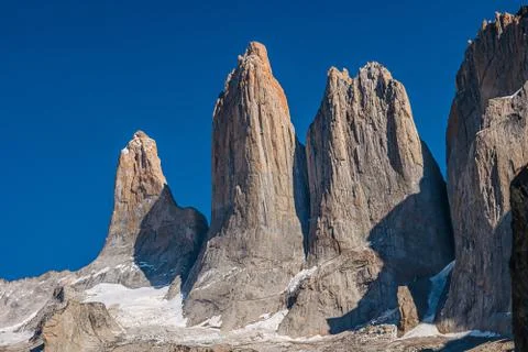 Three major peaks as summit teeth at blue sky In Torres del Paine National Pa Stock Photos