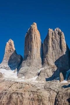 Three major peaks as summit teeth at blue sky In Torres del Paine National Pa Stock Photos