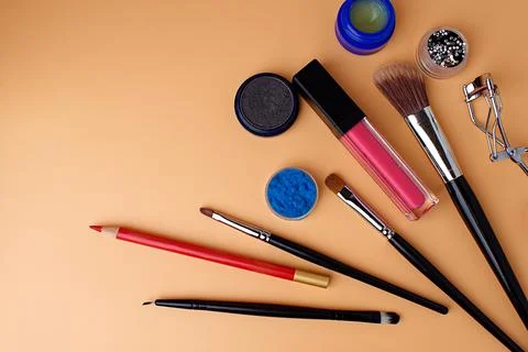 Three makeup brushes, brushes for blush, eyeshadow, lipstick, sponge Stock Photos