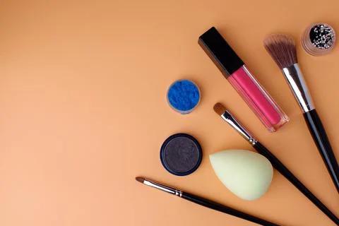 Three makeup brushes, brushes for blush, eyeshadow, lipstick, sponge Stock Photos