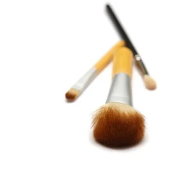 Three makeup brushes isolated on white background Stock Photos