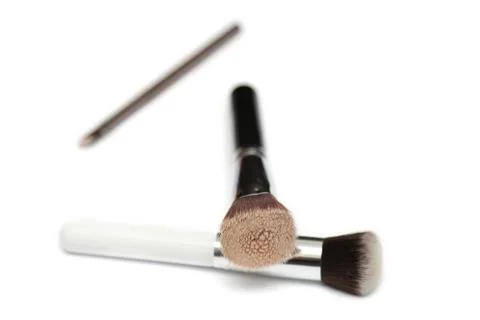 Three makeup brushes isolated on white background Stock Photos