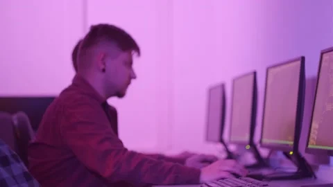 Three male programmers are leaning back in their chair and resting. Stock Footage 149077774