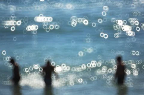 Three man in the ocean Stock Photos